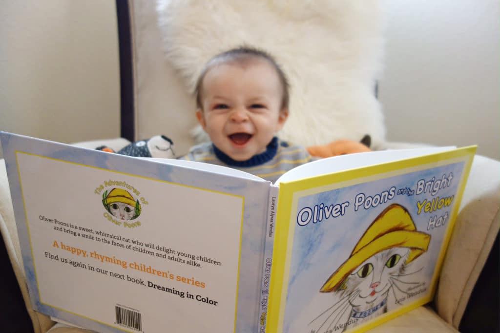 Baby Smiling Reading Oliver Poons